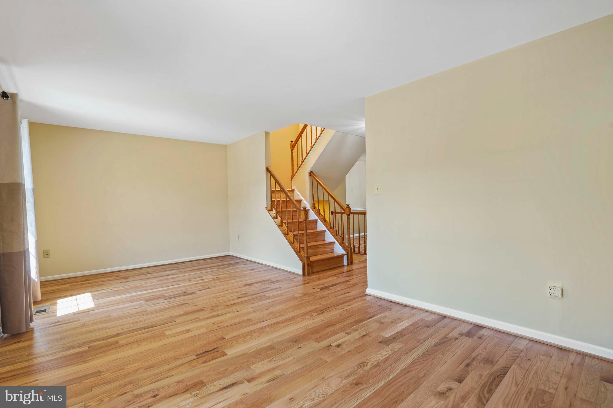 11322 Baritone Court Silver Spring, MD 20901 - Photo 5 of 29 a view of an empty room with wooden floor