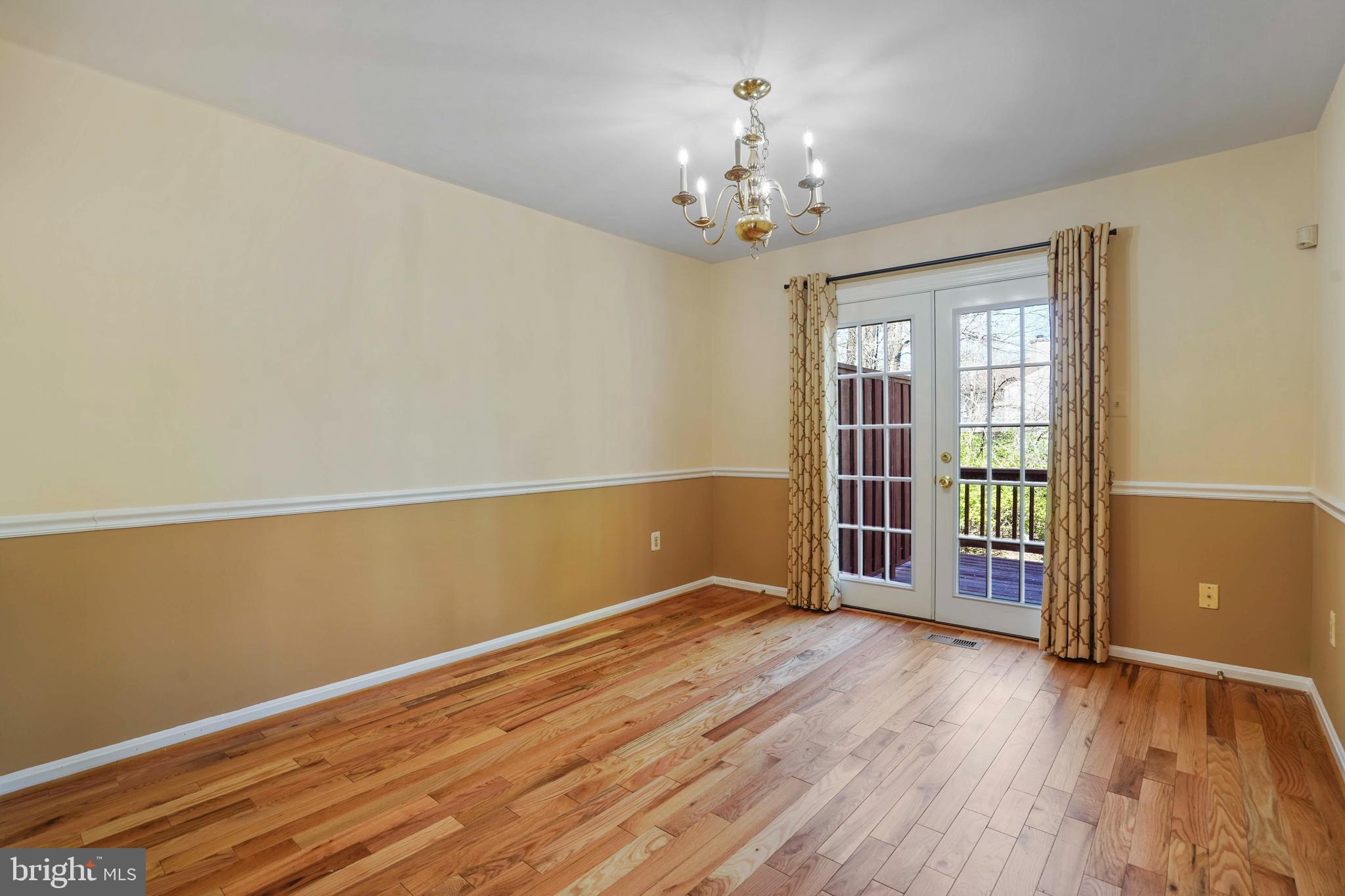 11322 Baritone Court Silver Spring, MD 20901 - Photo 7 of 29 a view of wooden floor and chandelier in a room