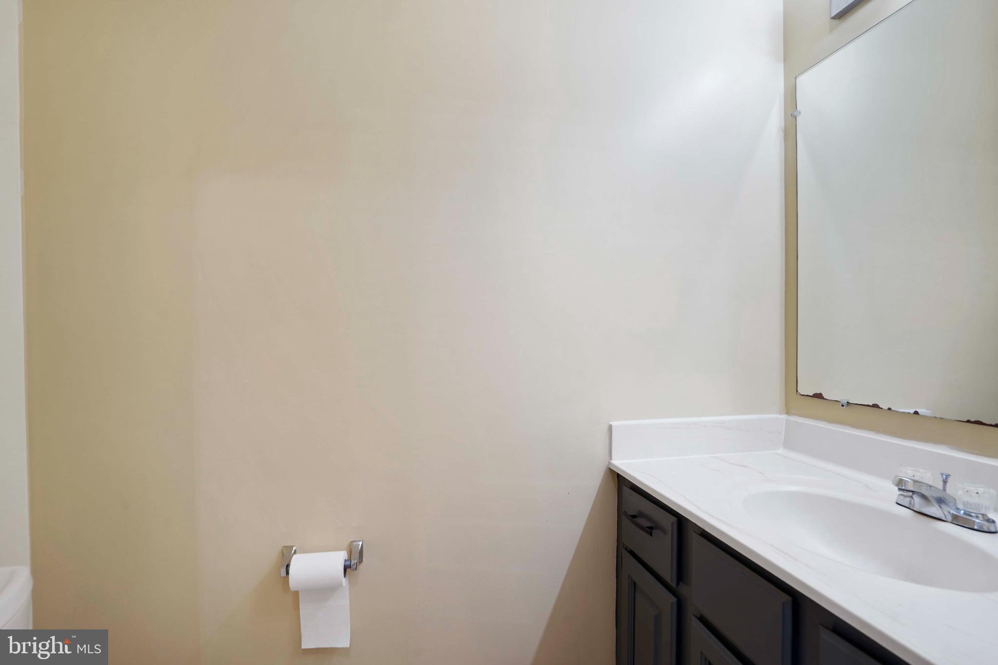 11322 Baritone Court Silver Spring, MD 20901 - Photo 9 of 29 a bathroom with a sink and a mirror