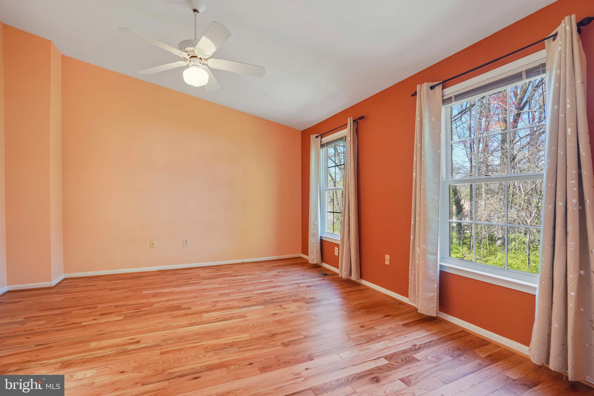 11322 Baritone Court Silver Spring, MD 20901 - Photo 10 of 29 a view of an empty room with wooden floor and a window