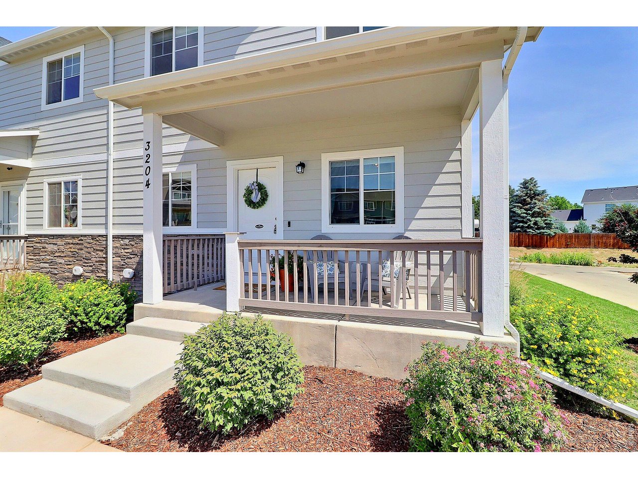 4355 24th Street Road, Unit 3204 Greeley, CO 80634 - Photo 2 of 34 Charming Covered Front Porch Entrance