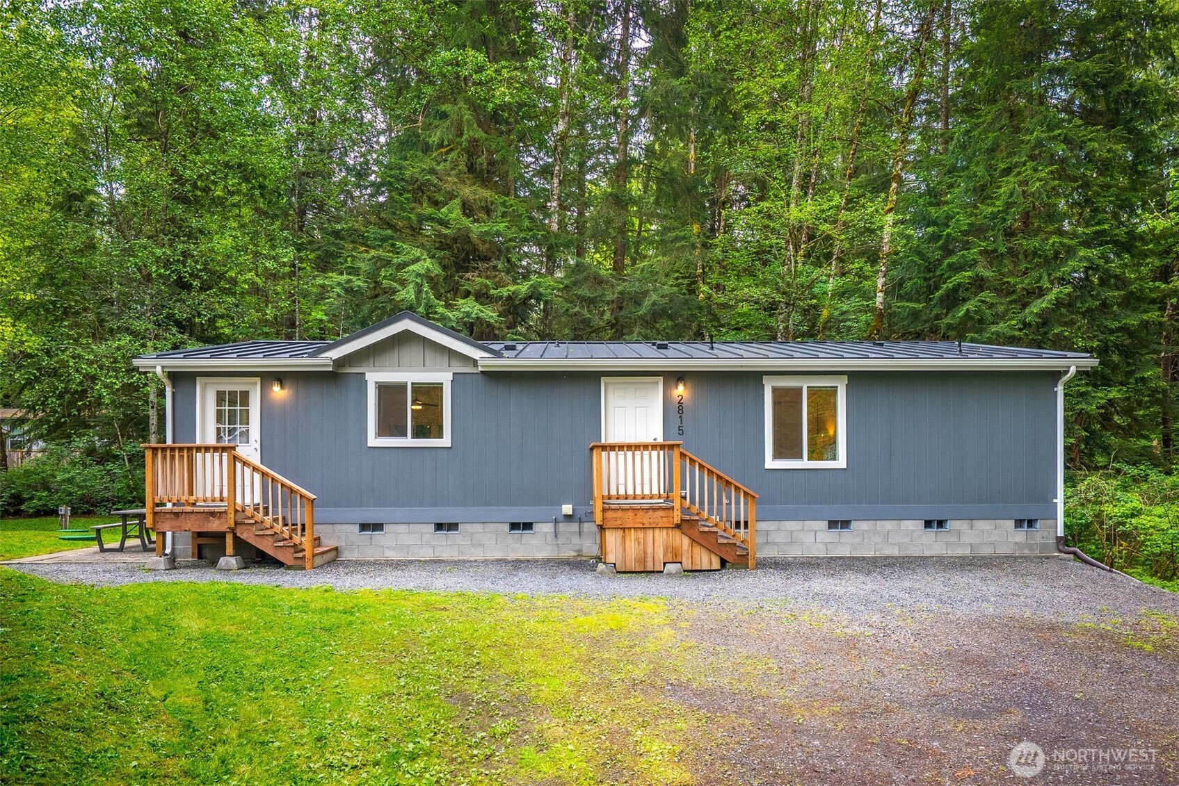 2815 Middle Shore Road Snohomish, WA 98290 - Photo 1 of 26 a front view of house with yard and trees in the background