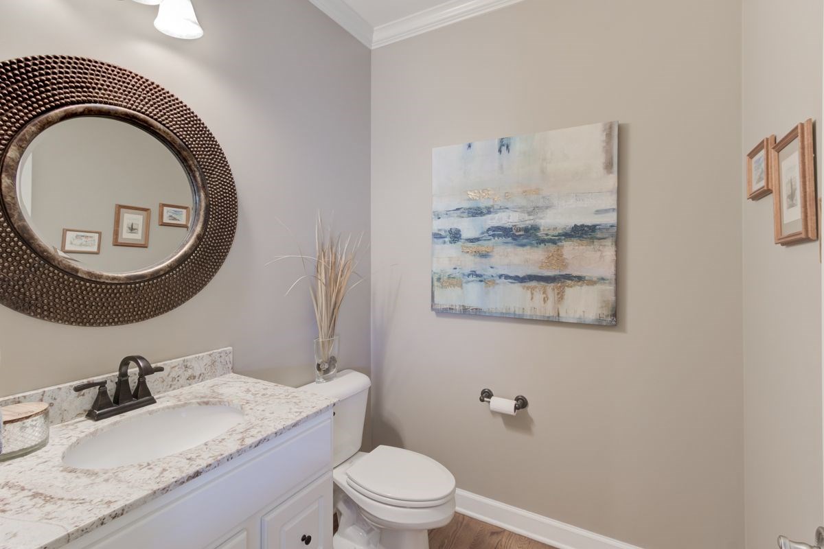 9465 Johnson Rd Extension Germantown, TN 38139 - Photo 13 of 25 Renovated powder room with hardwood floors and granite counters.