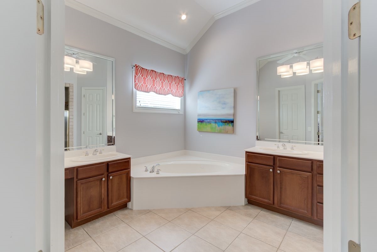 9465 Johnson Rd Extension Germantown, TN 38139 - Photo 15 of 25 Primary bathroom w/ double sinks, whirlpool tub, separate shower, and walk-in closet.