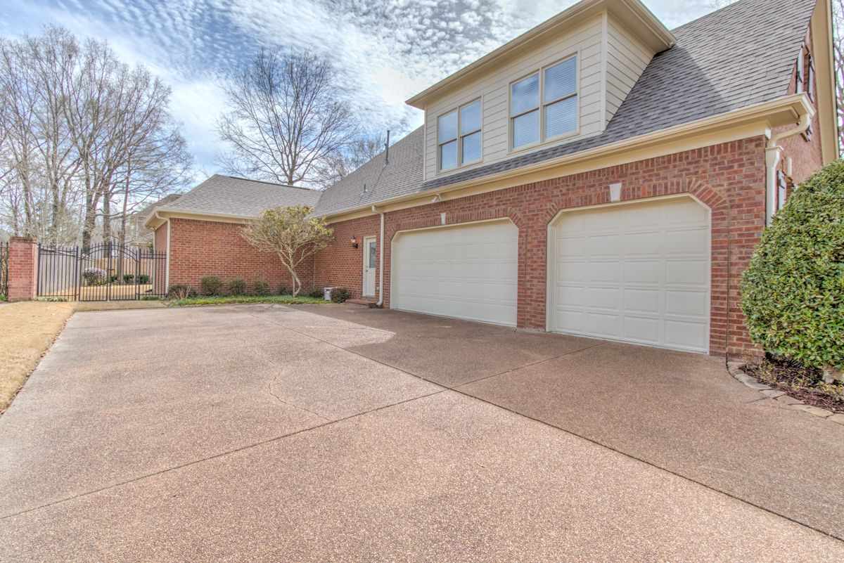 9465 Johnson Rd Extension Germantown, TN 38139 - Photo 25 of 25 3 car garage, friends entrance, and plenty of driveway space.