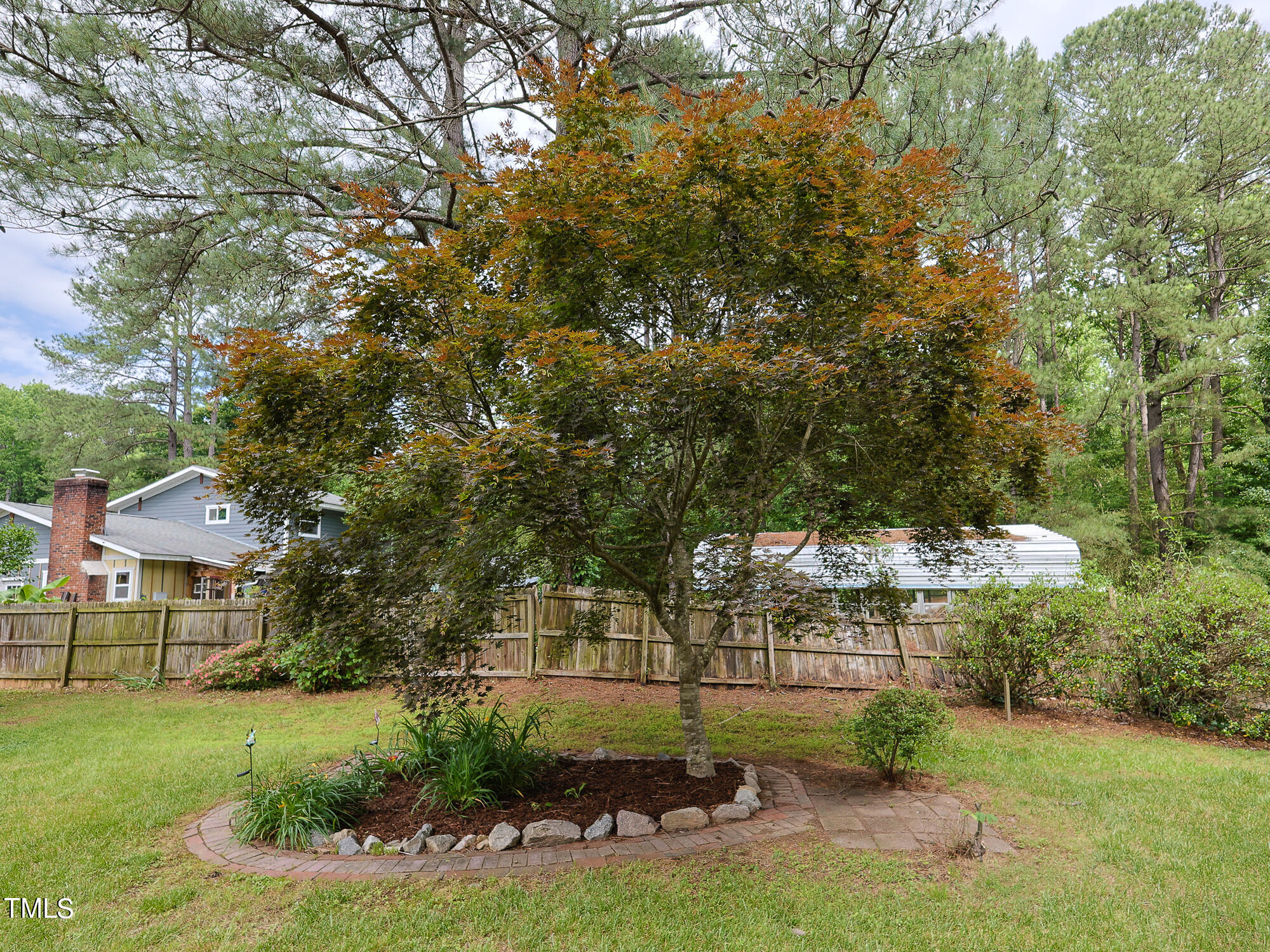 7208 Mine Shaft Road Raleigh, NC 27615 - Photo 28 of 29 a view of a chairs and table in backyard