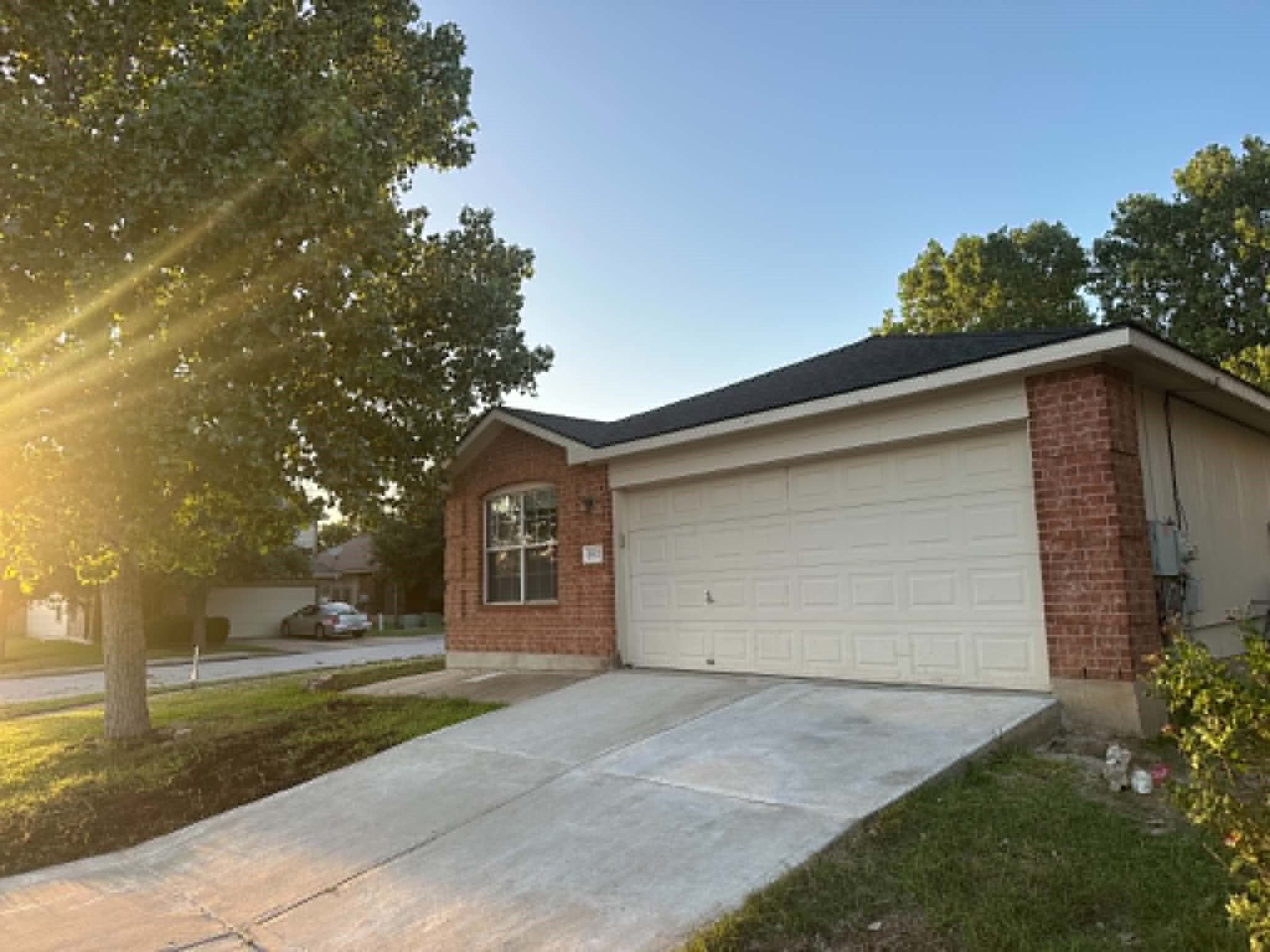 A classic brick exterior and a broad driveway welcome you home.