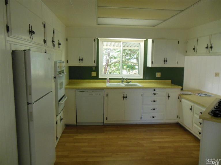 128 Sequoia Circle, Unit 128 Santa Rosa, CA 95401 - Photo 1 of 1 Big light, bright, kitchen with lots of cabinet and countertop space