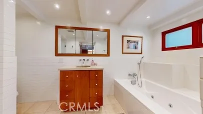 a bathroom with a bathtub and a sink