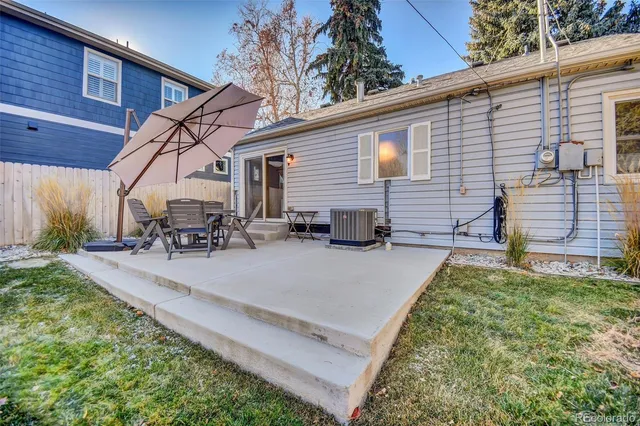a view of a backyard with sitting area