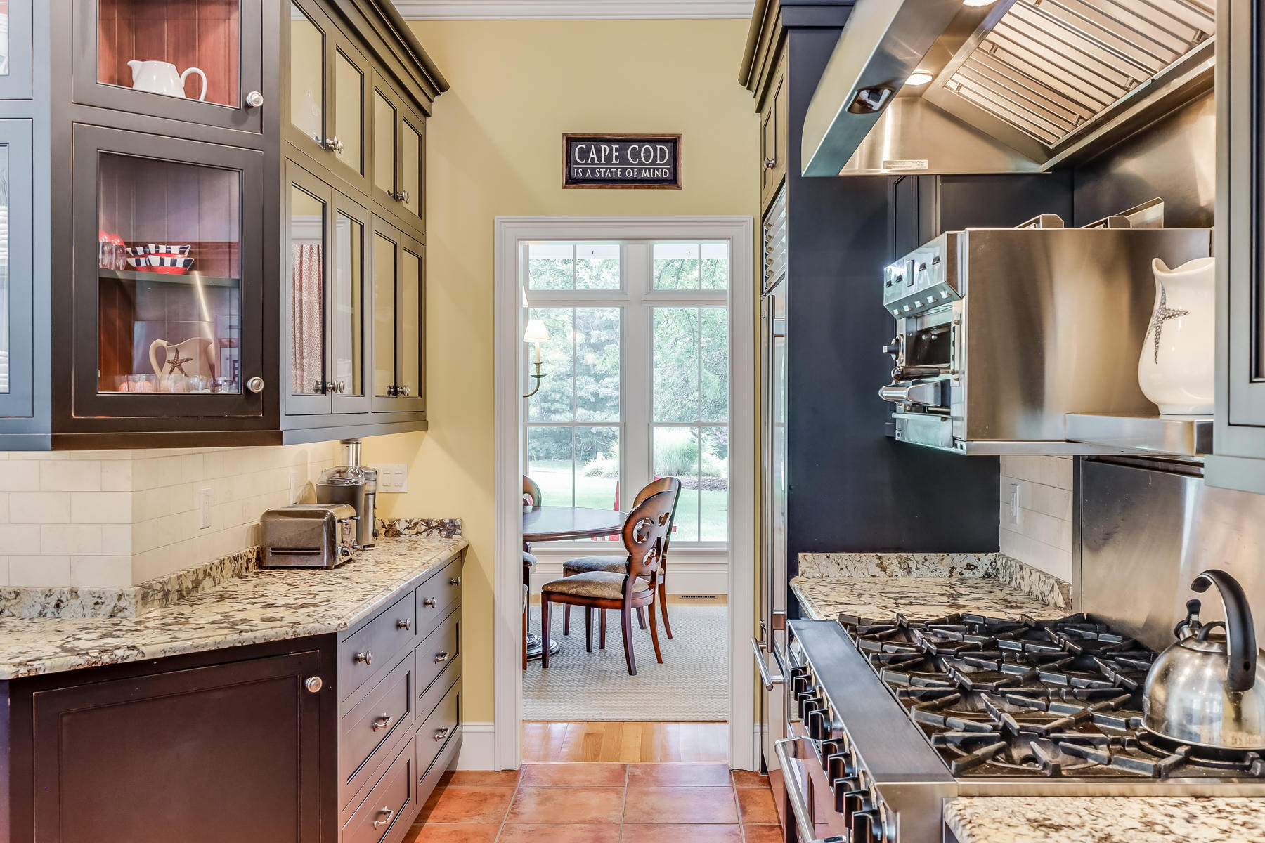 51 Meadow Farm Road Centerville, MA 02632 - Photo 12 of 45 a kitchen with stainless steel appliances granite countertop a stove and a sink