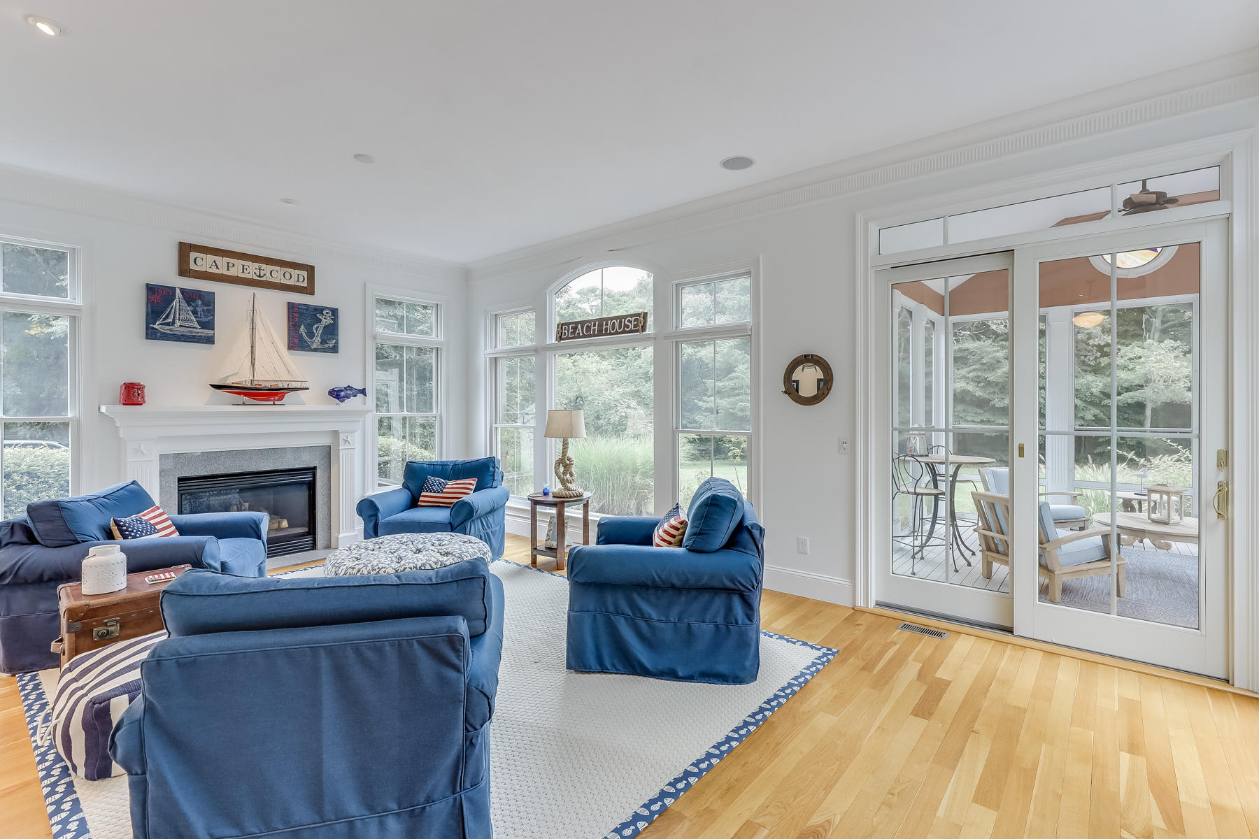 51 Meadow Farm Road Centerville, MA 02632 - Photo 16 of 45 a living room with furniture and a fireplace