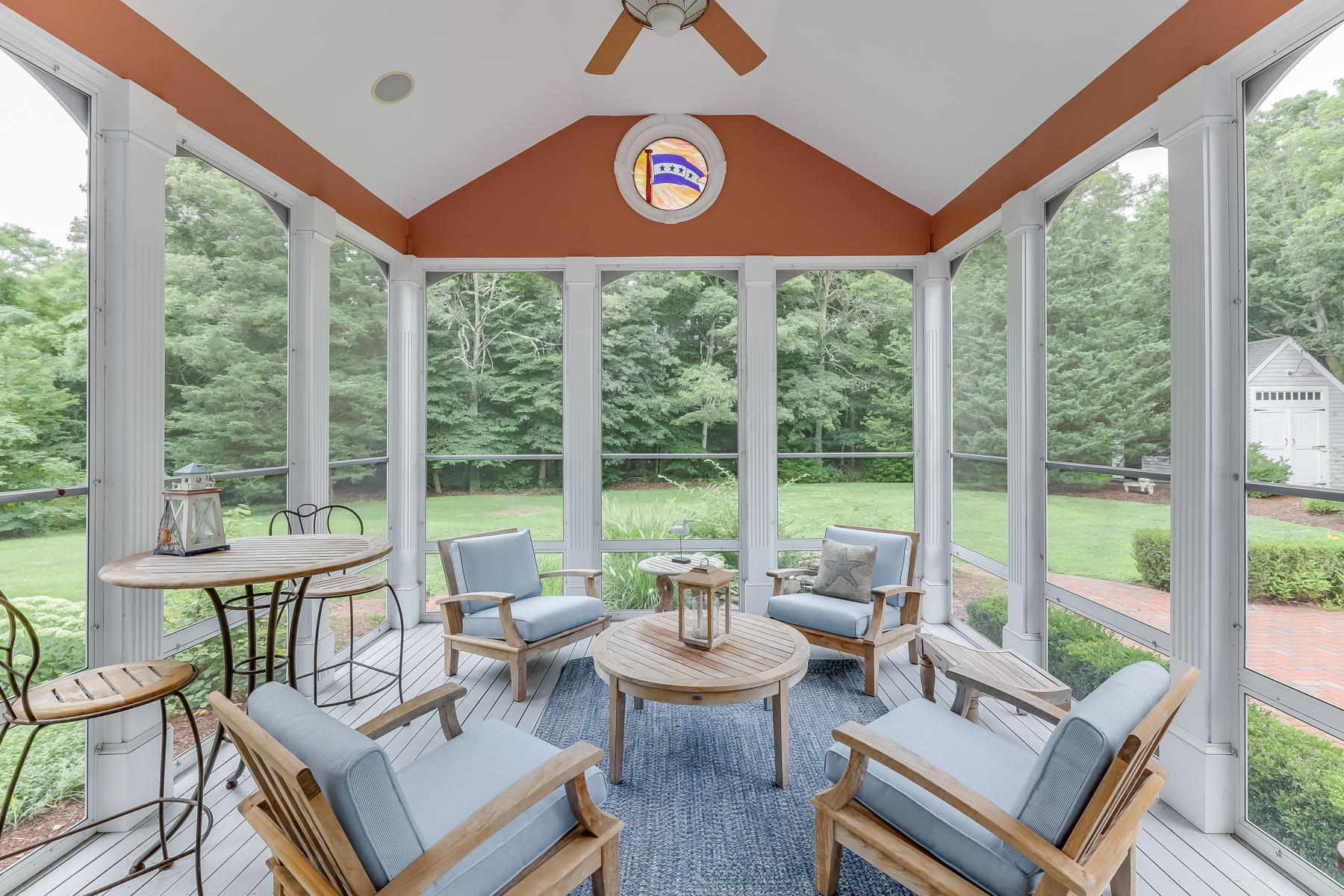 51 Meadow Farm Road Centerville, MA 02632 - Photo 19 of 45 a living room with furniture and a floor to ceiling window