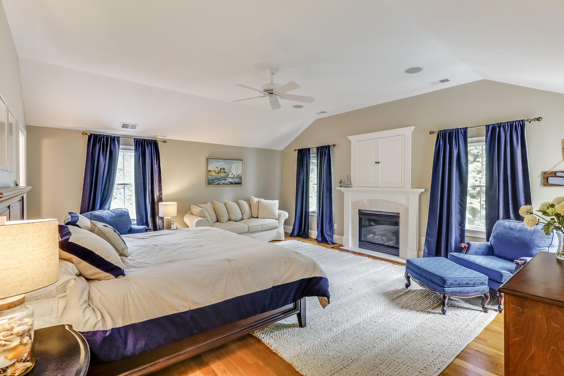 51 Meadow Farm Road Centerville, MA 02632 - Photo 22 of 45 a bedroom with a bed and a fireplace