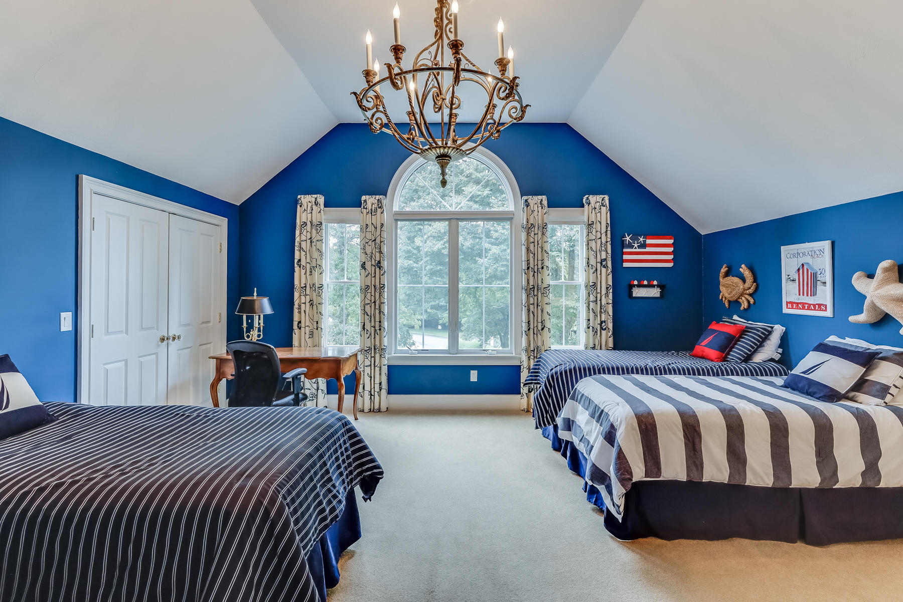 51 Meadow Farm Road Centerville, MA 02632 - Photo 25 of 45 a bedroom with a bed and a chandelier