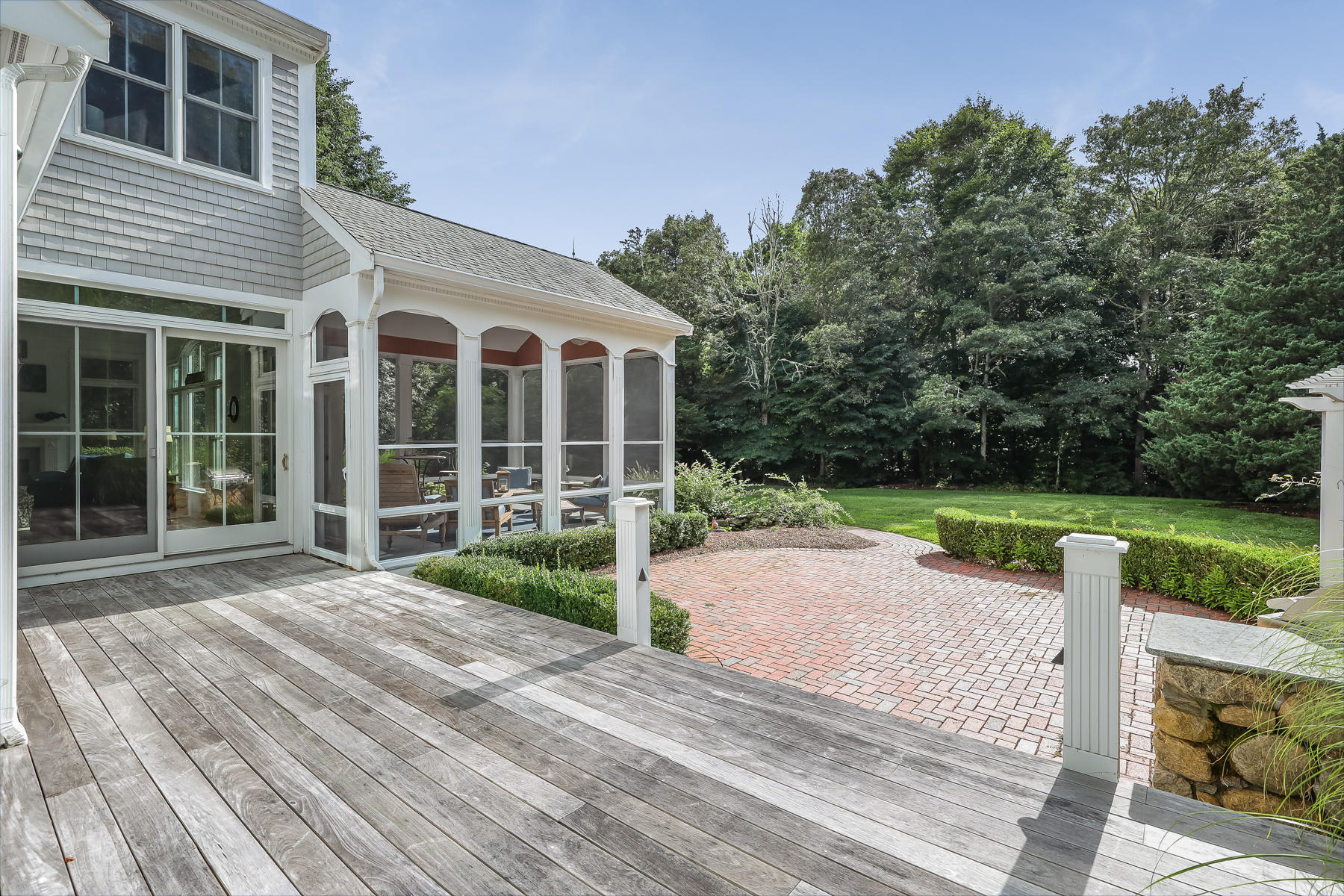 51 Meadow Farm Road Centerville, MA 02632 - Photo 36 of 45 a view of a house with a yard and potted plants