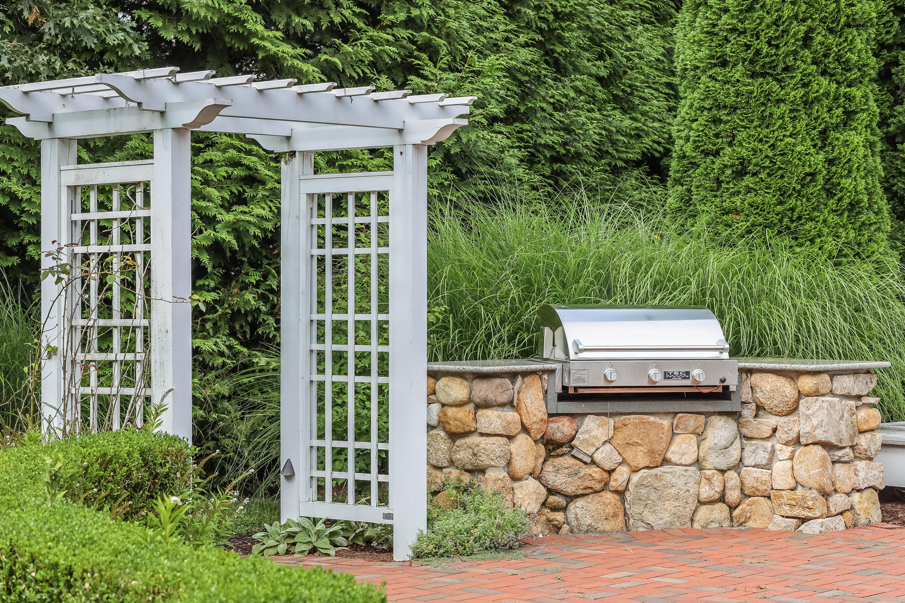 51 Meadow Farm Road Centerville, MA 02632 - Photo 37 of 45 a front view of a house with a garden