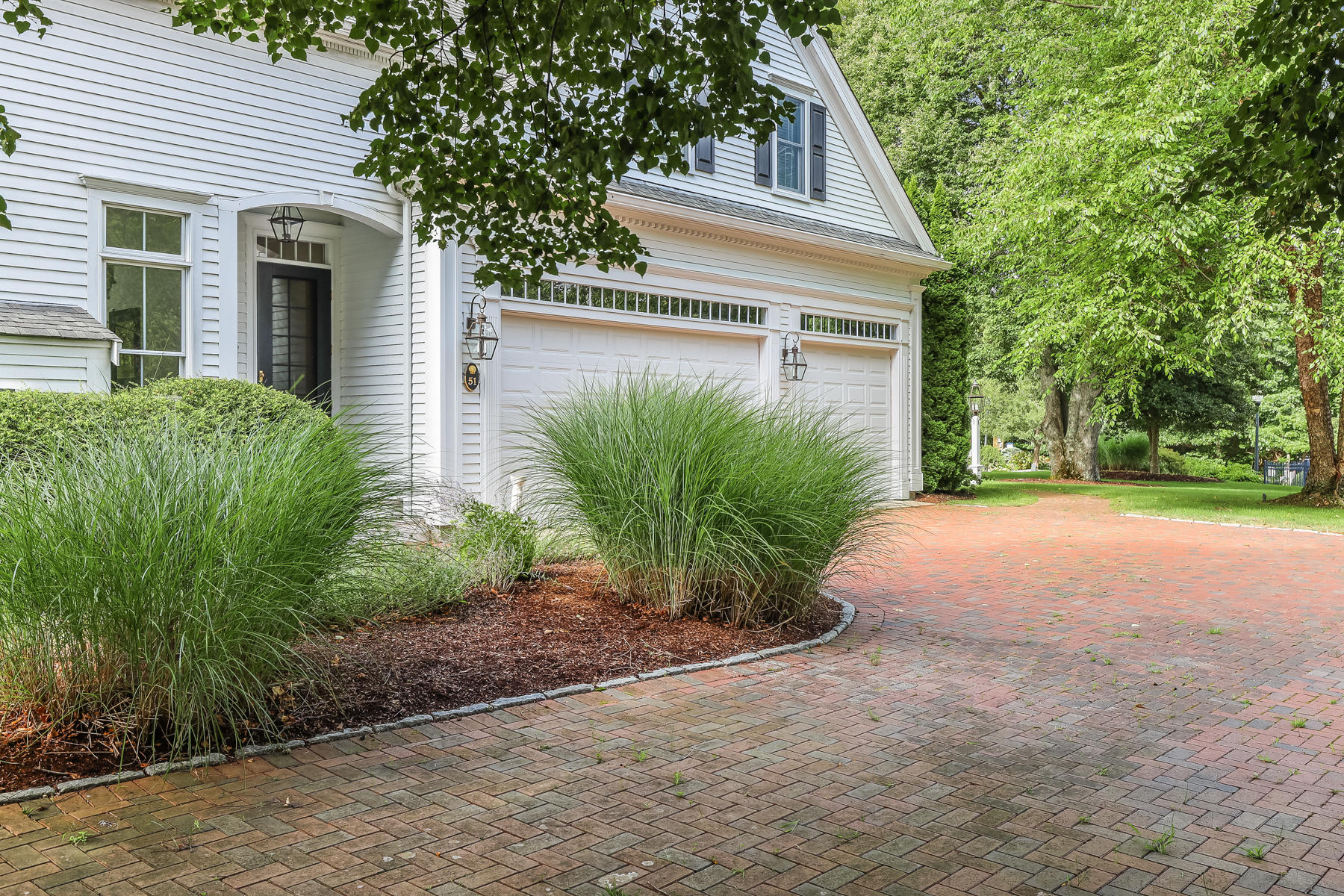 51 Meadow Farm Road Centerville, MA 02632 - Photo 41 of 45 a front view of a house with garden
