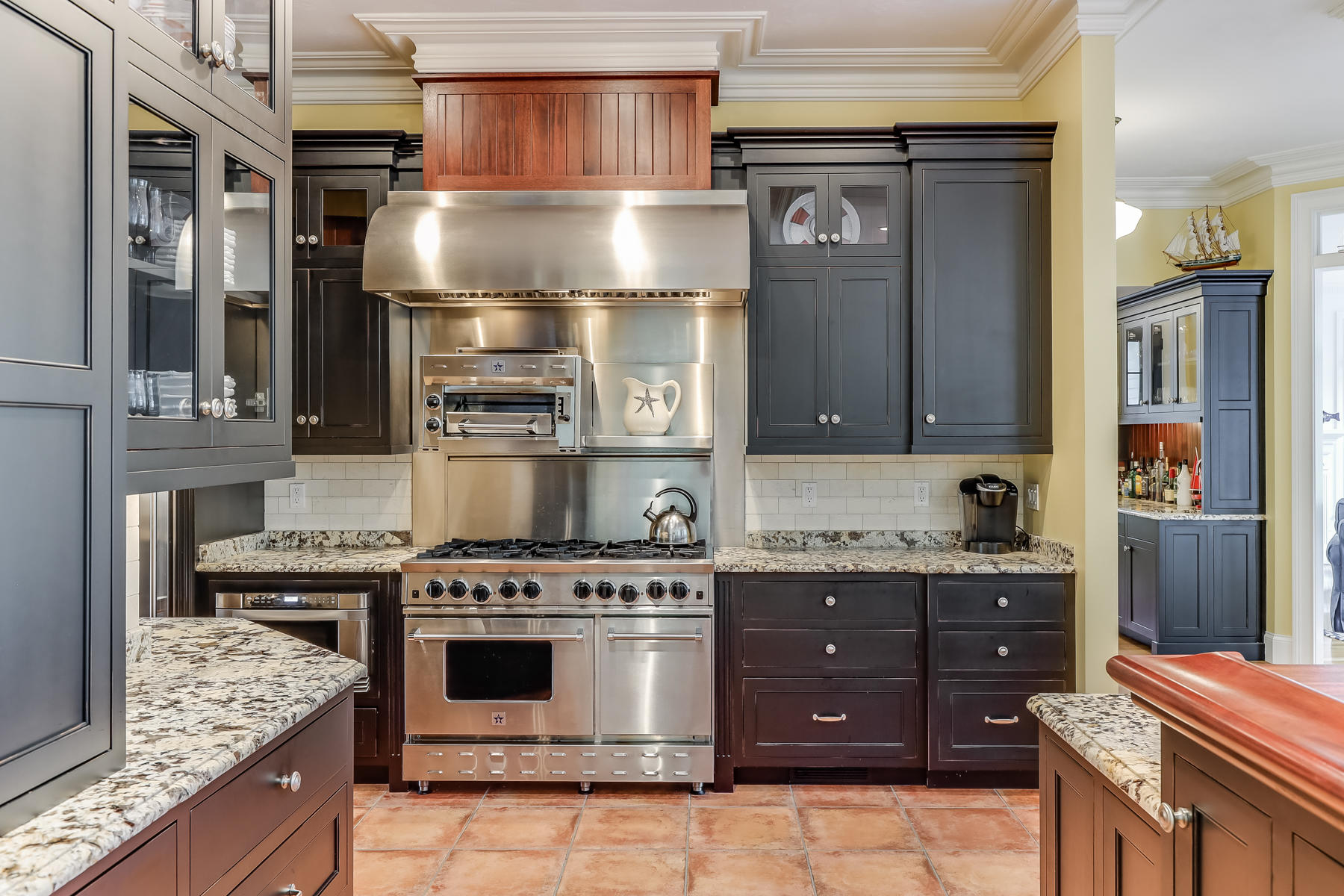51 Meadow Farm Road Centerville, MA 02632 - Photo 9 of 45 a kitchen with a stove and a refrigerator