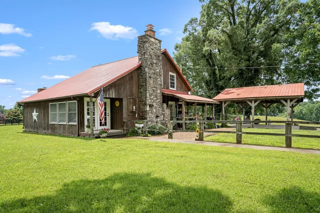 a view of a house with a yard porch and sitting area