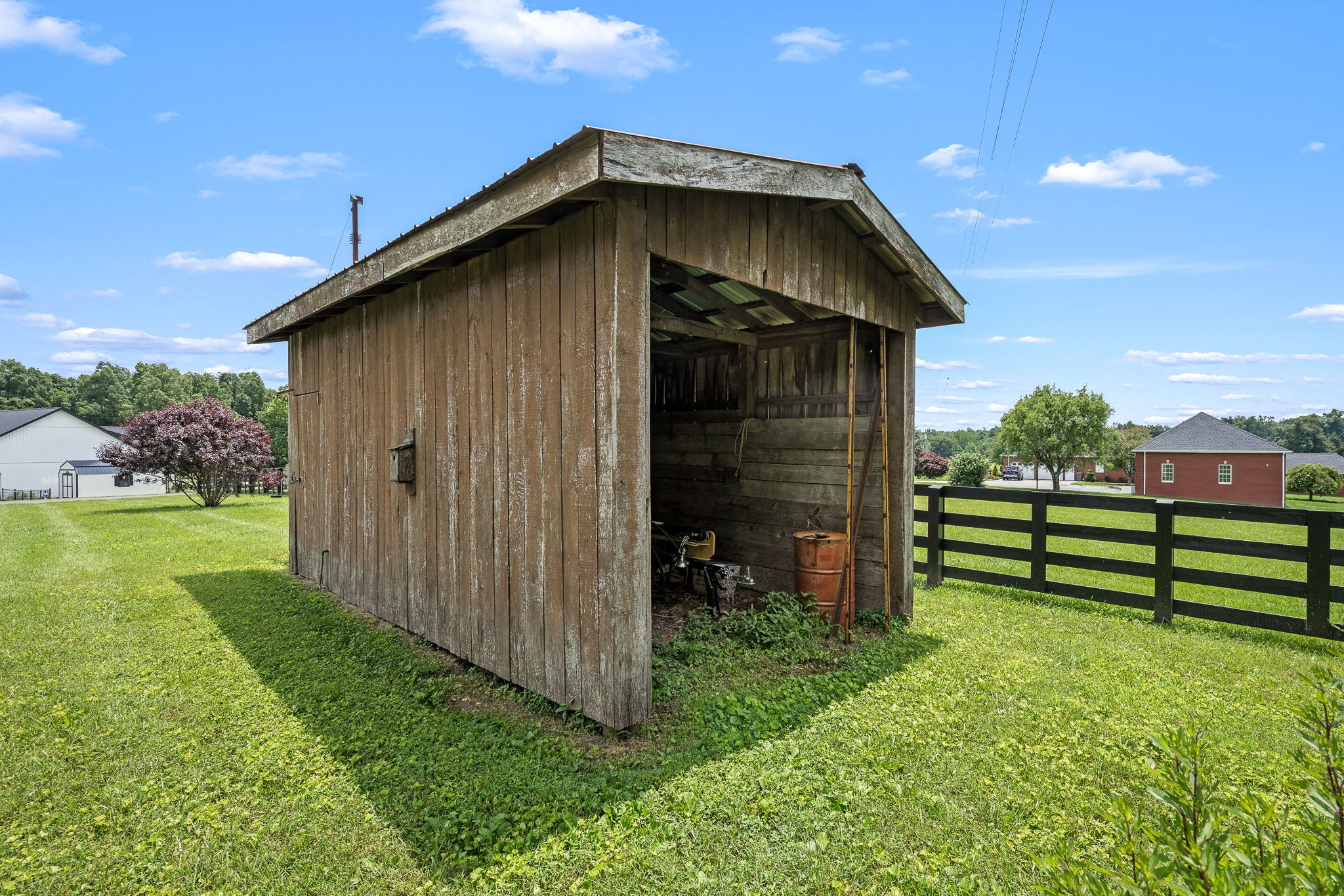540 Powell Hollow Road Tullahoma, TN 37388 - Photo 50 of 83 a view of a wooden house with a small yard