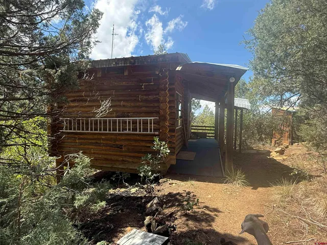 a view of backyard with a table and chairs