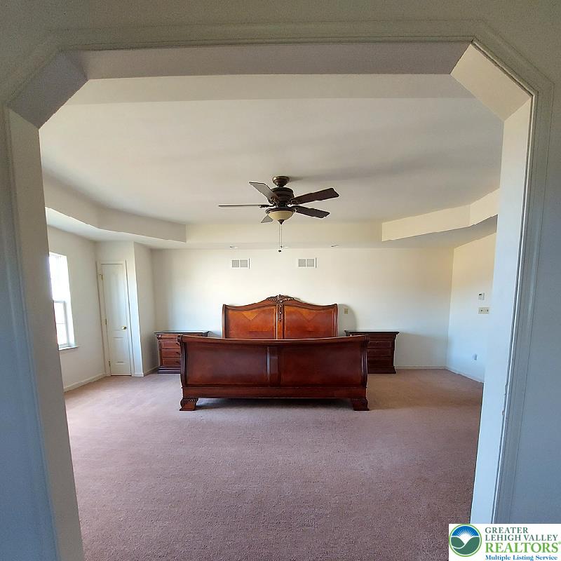 4704 Reston Drive Easton, PA 18040 - Photo 18 of 32 a living room with furniture and a ceiling fan