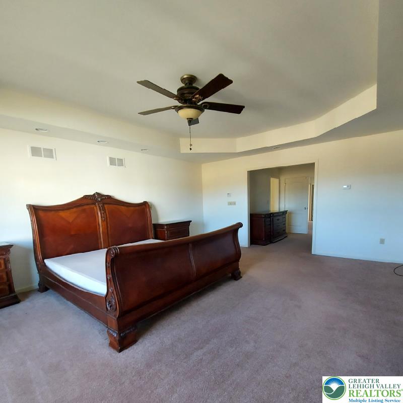 4704 Reston Drive Easton, PA 18040 - Photo 19 of 32 a living room with furniture and a ceiling fan