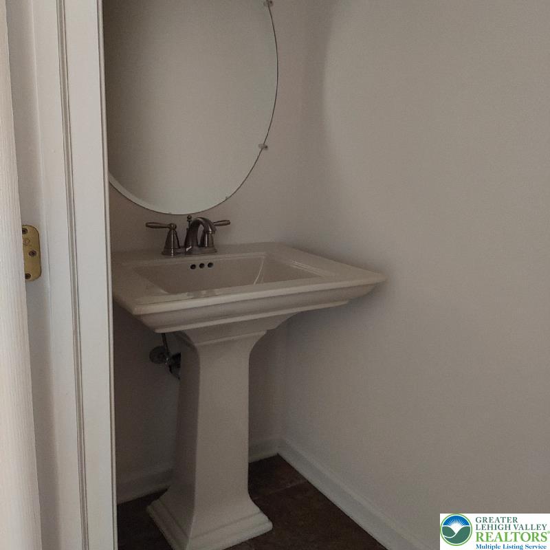 4704 Reston Drive Easton, PA 18040 - Photo 20 of 32 a bathroom with a sink and mirror