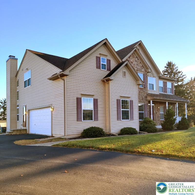 4704 Reston Drive Easton, PA 18040 - Photo 2 of 32 a front view of a house with a yard