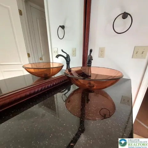 a room with a table and a chandelier