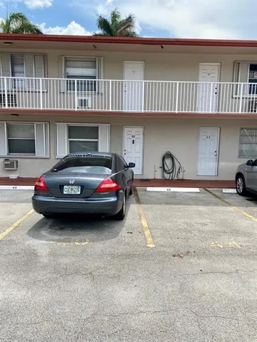 a car parked in front of a building