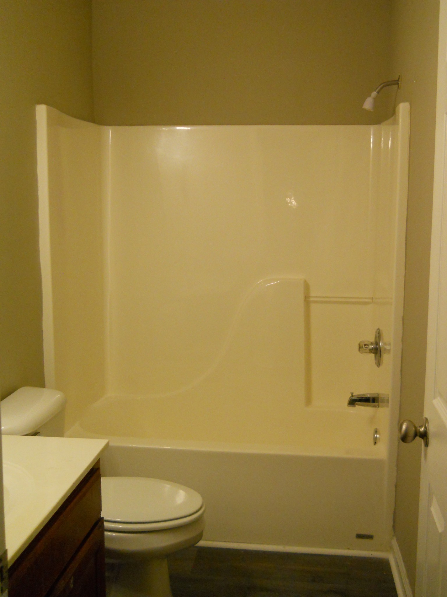 9995 Chestnut Ridge Road Lynchburg, TN 37352 - Photo 12 of 14 a bathroom with a shower curtain and a toilet