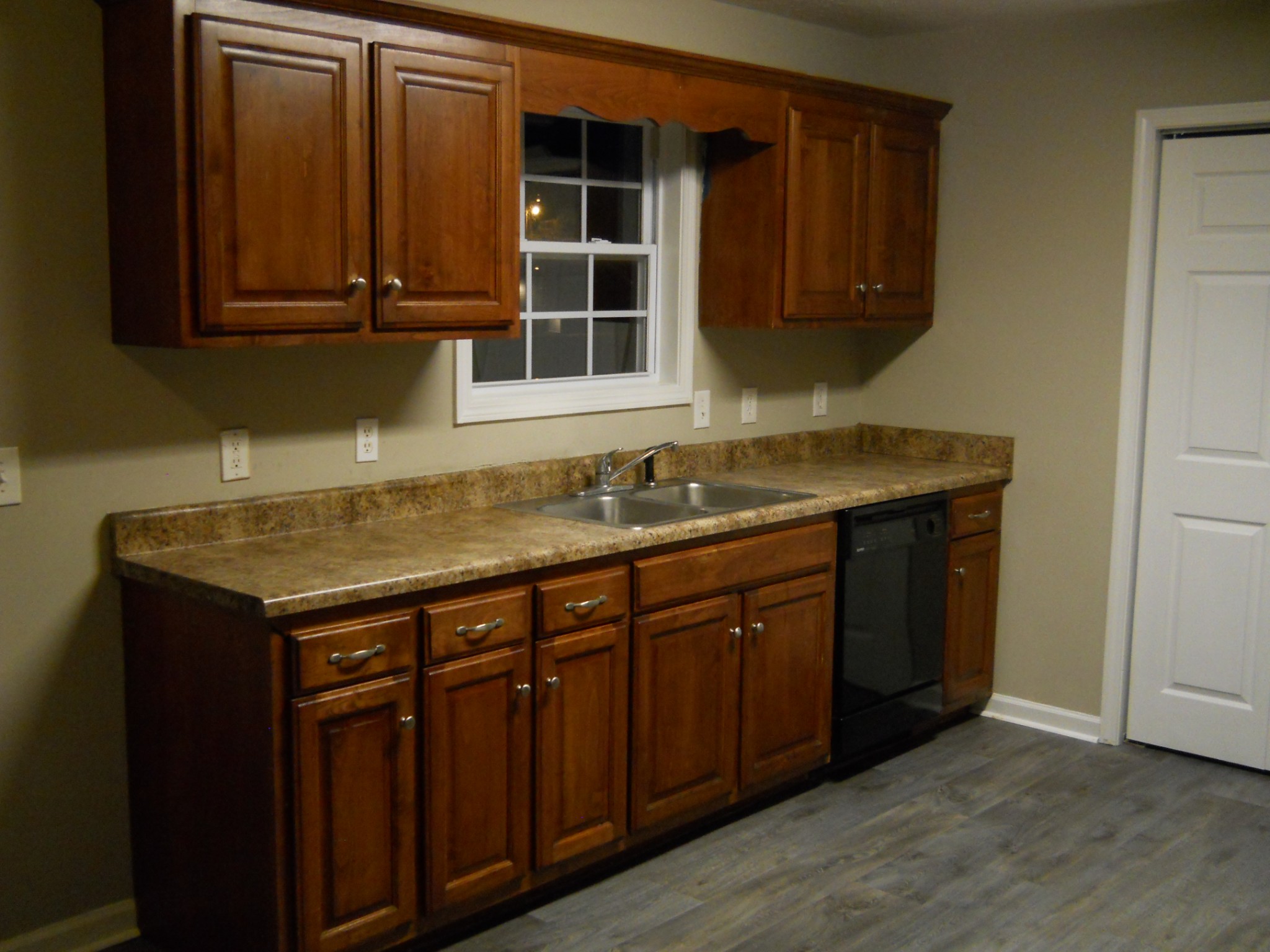 9995 Chestnut Ridge Road Lynchburg, TN 37352 - Photo 4 of 14 a kitchen with a sink and cabinets
