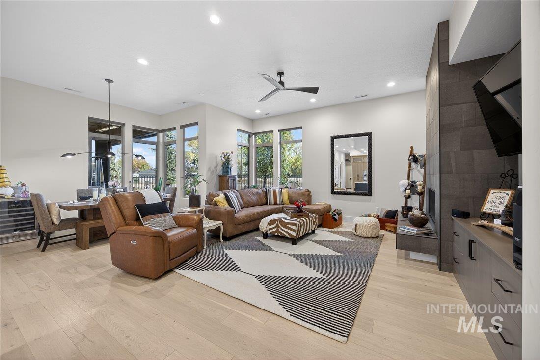 4718 East Goldstone Drive Meridian, ID 83642 - Photo 19 of 50 Living area featuring a ceiling fan, light wood-style floors, and recessed lighting