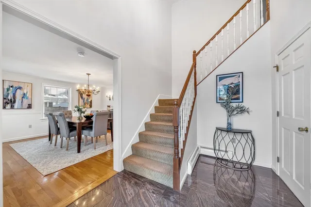 a bathroom with a sink mirror and toilet