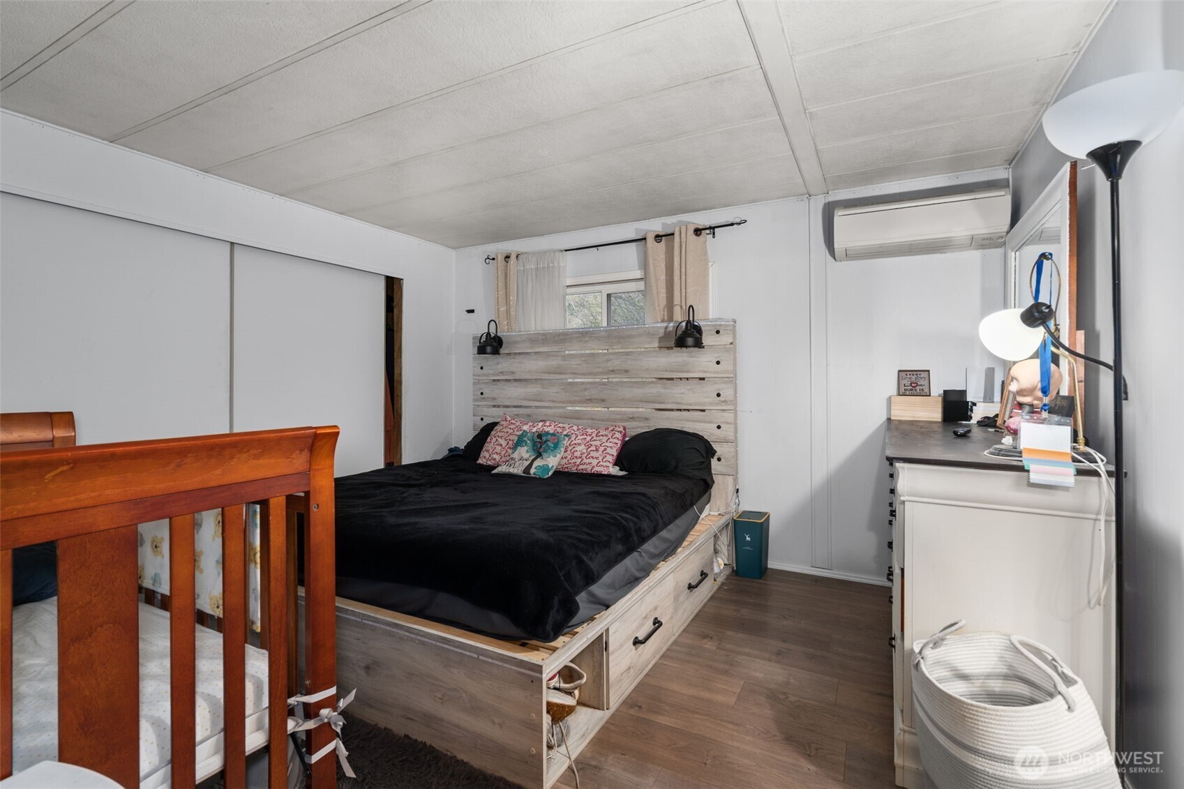 4692 Sherman Heights Road Bremerton, WA 98312 - Photo 14 of 28 a bedroom with a bed and a fireplace