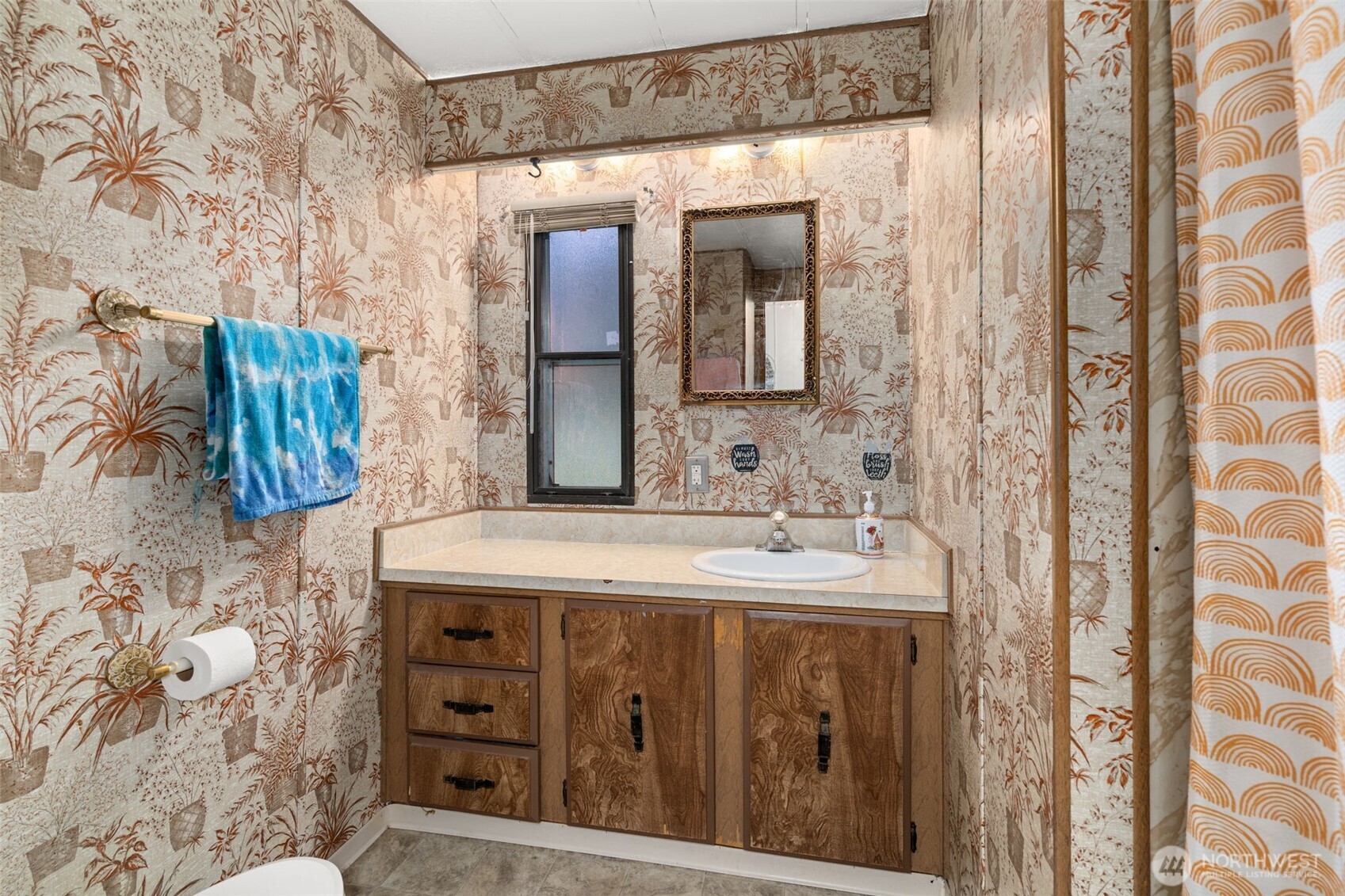 4692 Sherman Heights Road Bremerton, WA 98312 - Photo 19 of 28 a bathroom with a sink and a mirror