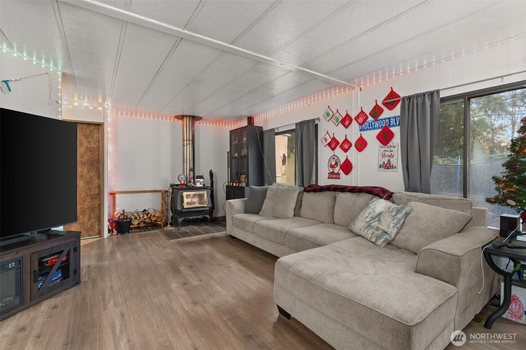 4692 Sherman Heights Road Bremerton, WA 98312 - Photo 6 of 28 a living room with furniture and a flat screen tv