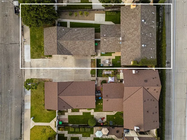 a kitchen with stainless steel appliances granite countertop a sink refrigerator and cabinets