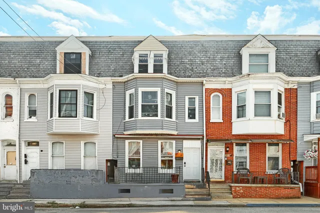 a front view of a building with glass windows