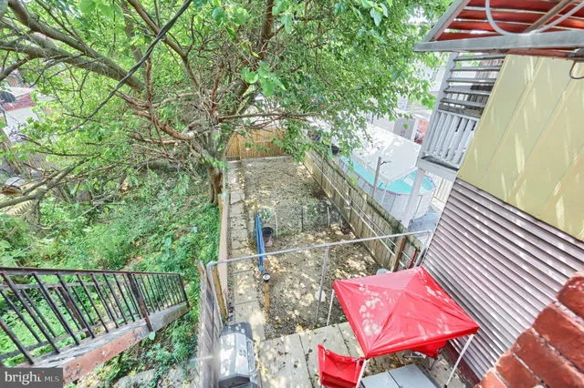a view of a balcony with furniture