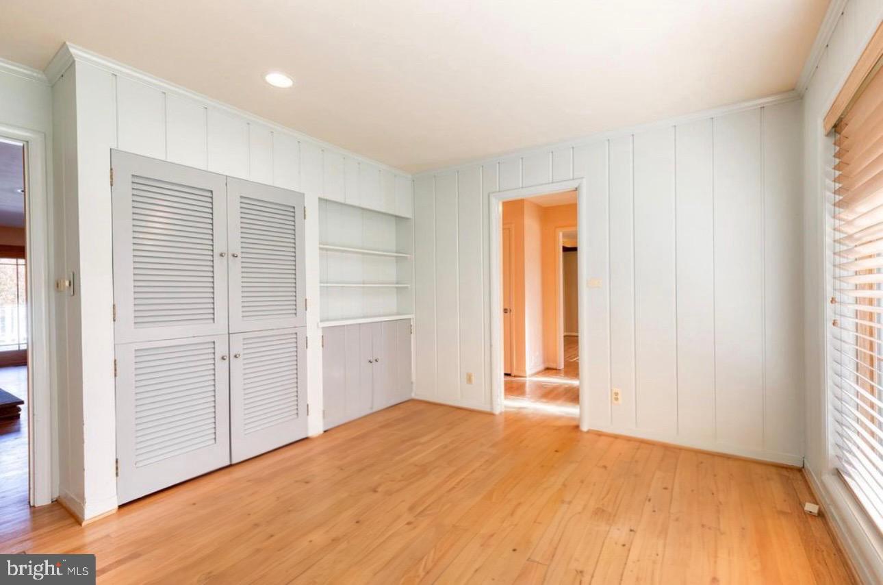 602 Hampton Lane Baltimore, MD 21286 - Photo 11 of 41 a view of empty room with wooden floor and fan