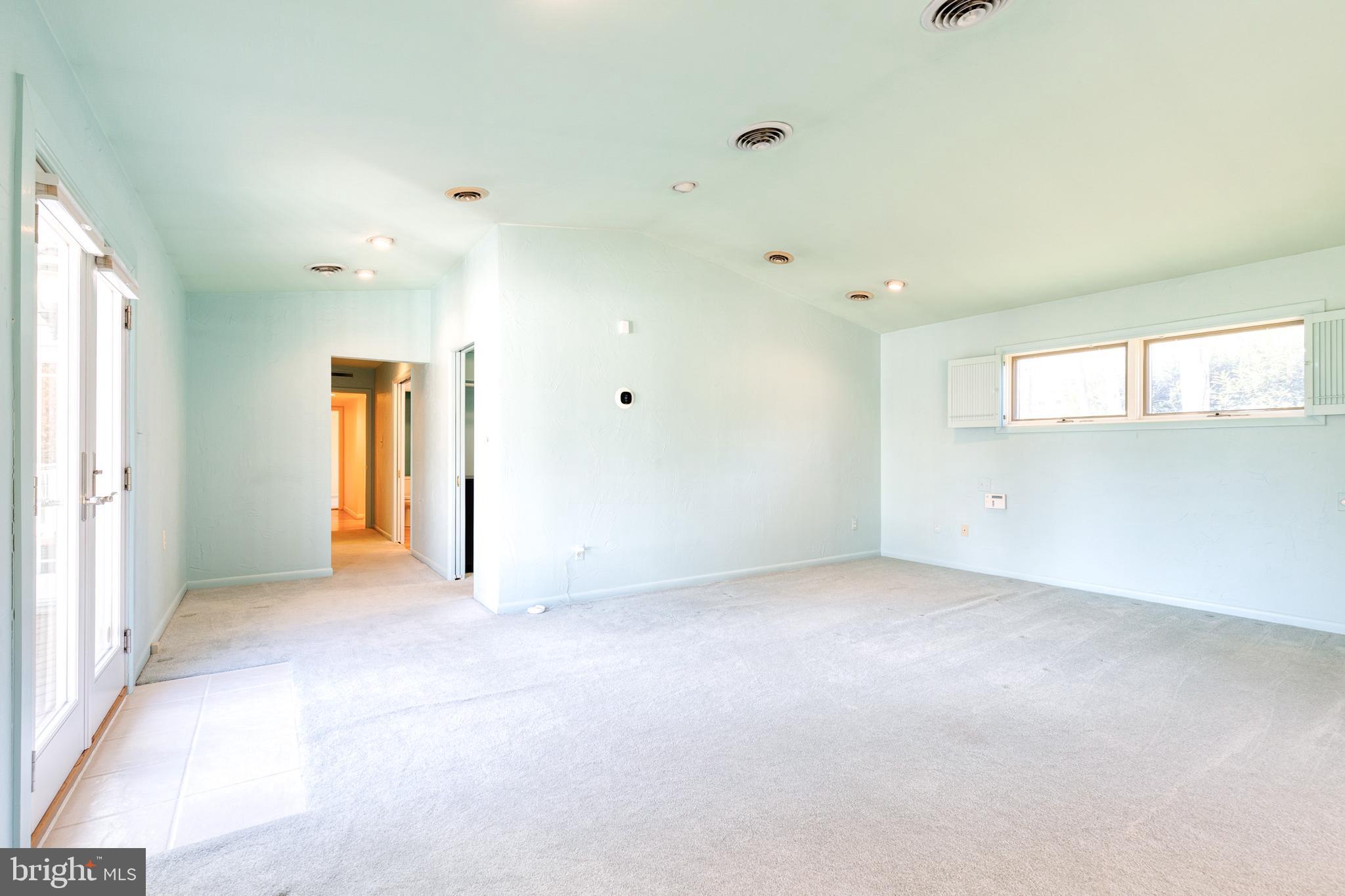 602 Hampton Lane Baltimore, MD 21286 - Photo 21 of 41 an empty room with a window and a kitchen