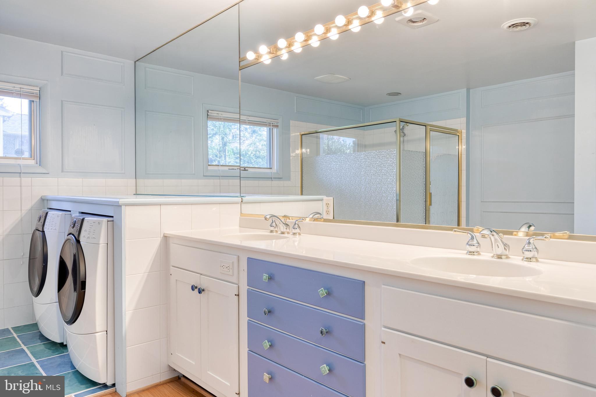 602 Hampton Lane Baltimore, MD 21286 - Photo 26 of 41 a bathroom with a sink a mirror and vanity