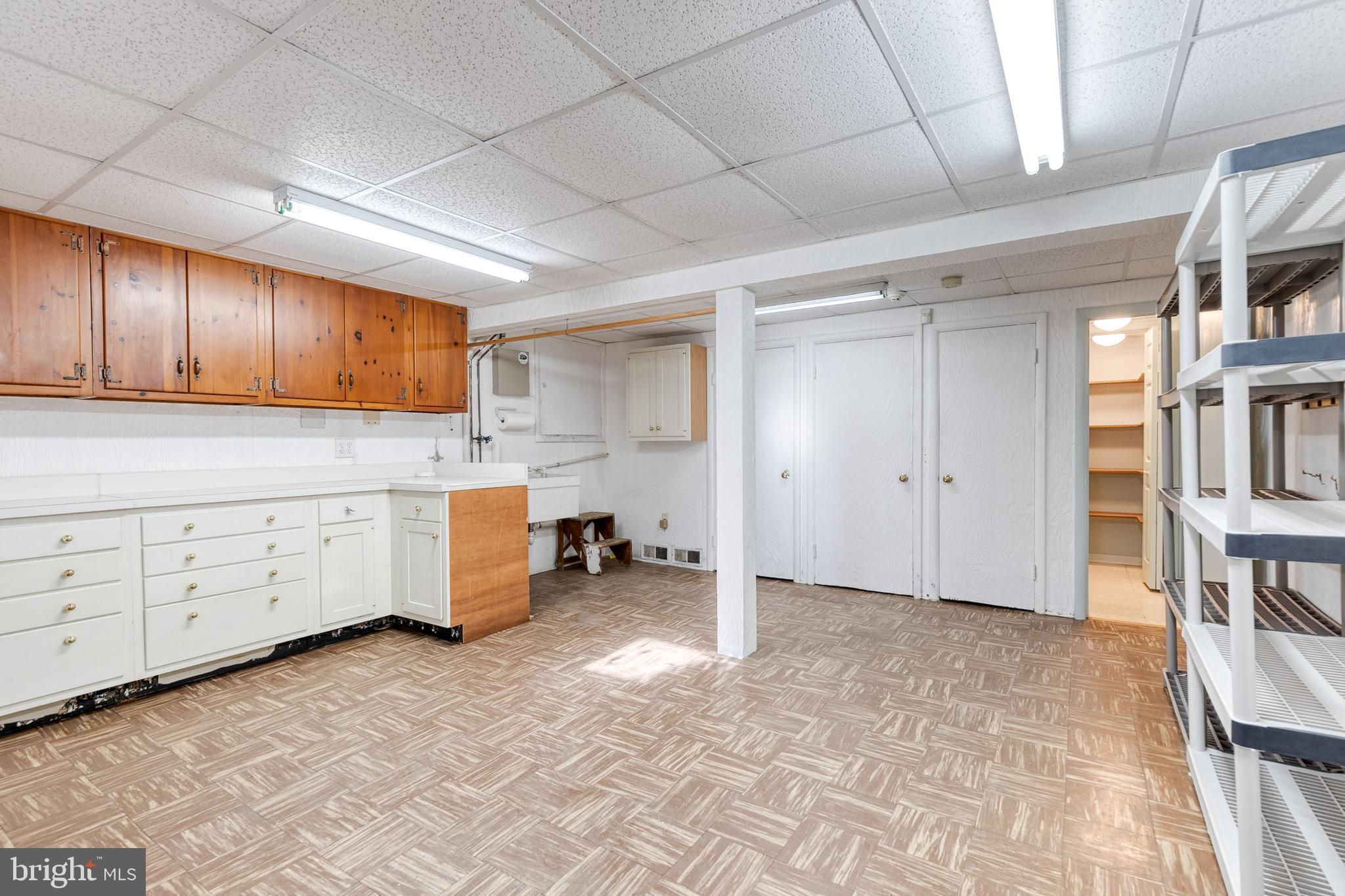 602 Hampton Lane Baltimore, MD 21286 - Photo 33 of 41 a kitchen with granite countertop a stove a sink a refrigerator and cabinets