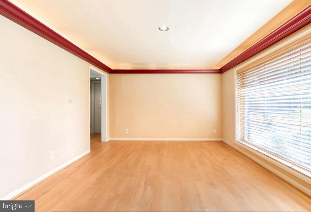 602 Hampton Lane Baltimore, MD 21286 - Photo 7 of 41 a view of an empty room with a window