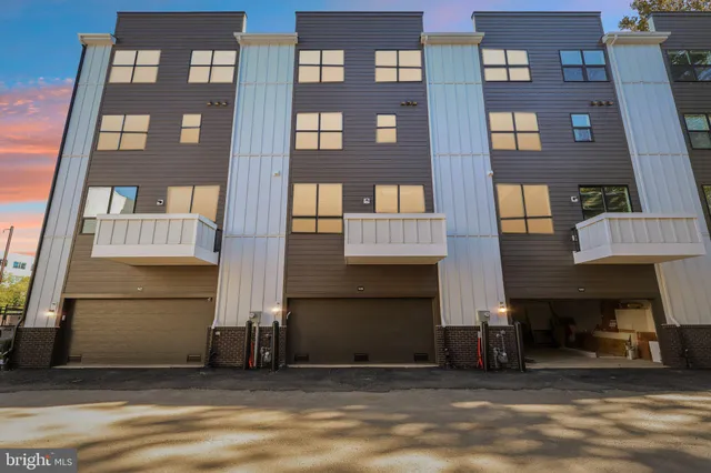 a view of a pathway of house with a yard