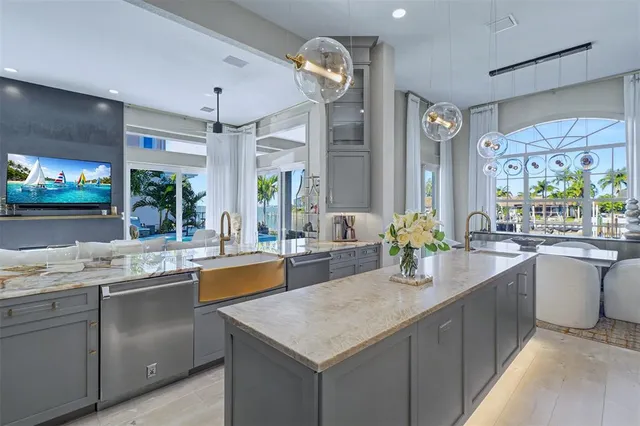a kitchen with counter top space sink and stove