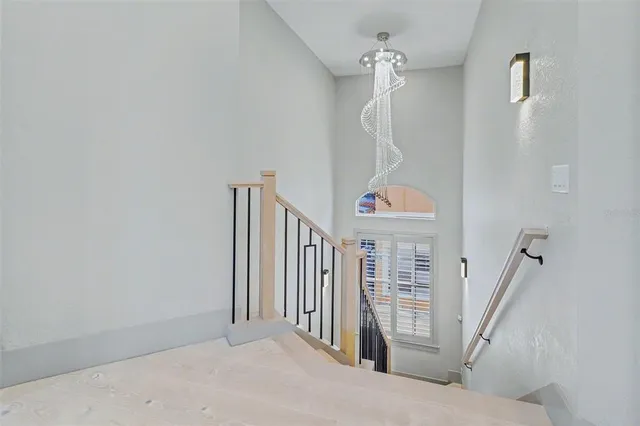 a view of a hallway with staircase